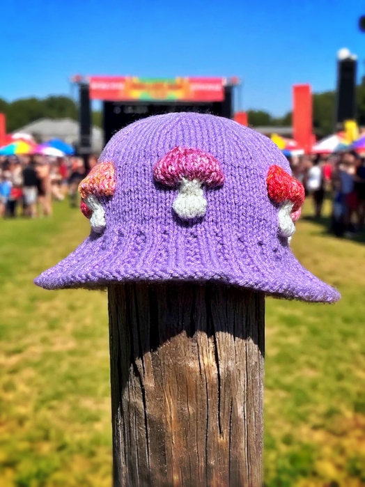 Knitted bucket hat with toadstool mushrooms around the brim