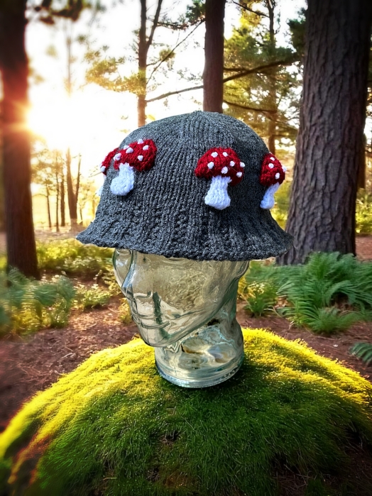 Knitted bucket hat with toadstool mushrooms around the brim