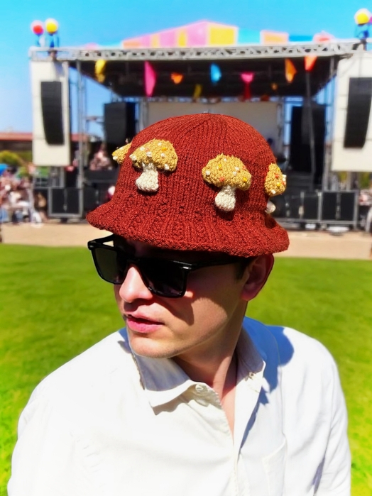 Knitted bucket hat with toadstool mushrooms around the brim