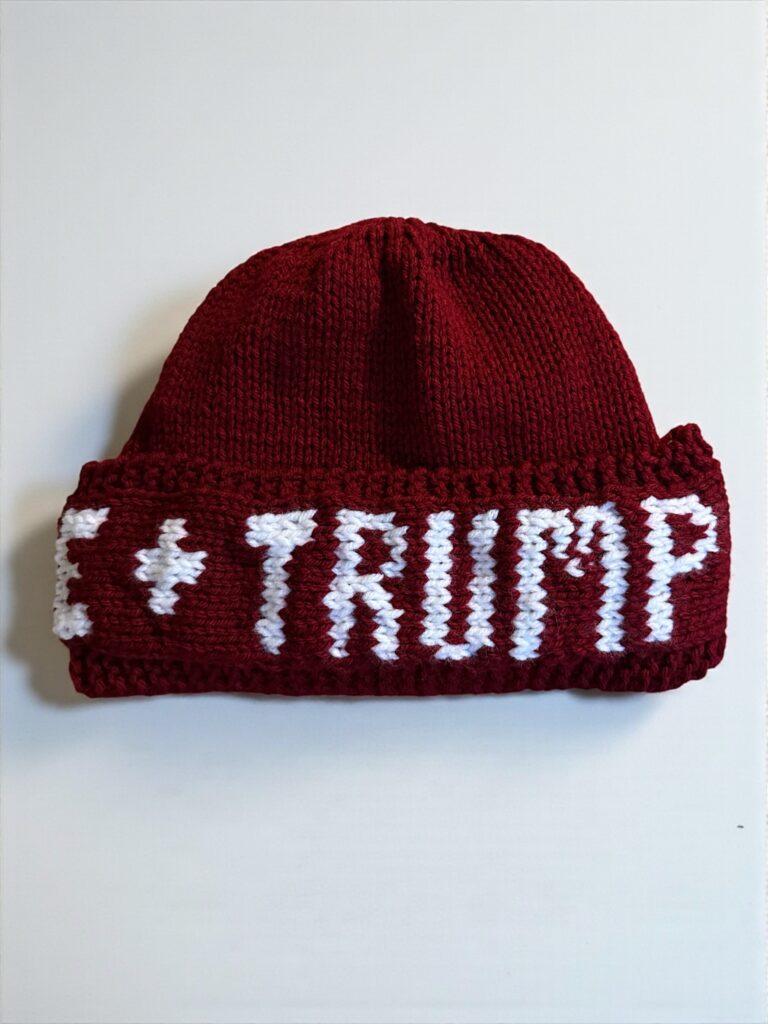 Hand-knit protest beanie with colorwork lettering that reads ‘F*ck ICE + Trump.’ Free knitting pattern.