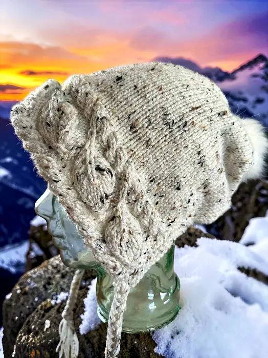 Close-up of knitted leaf stitch detail on slouchy hat