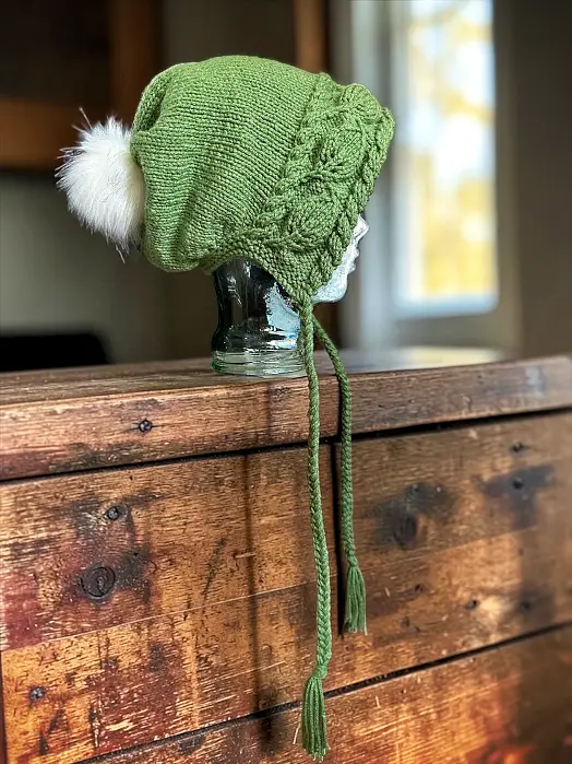 Slouchy knit hat laid flat displaying leaf-texture stitch pattern