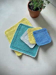 Free knit dishcloth pattern knit flat on straight needles with crossed stitch texture and crochet edge