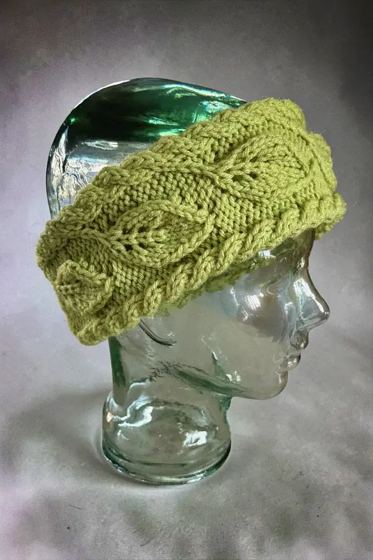 Warm textured knit headband with leaf pattern ideal for cold weather ear warmer free knitting pattern