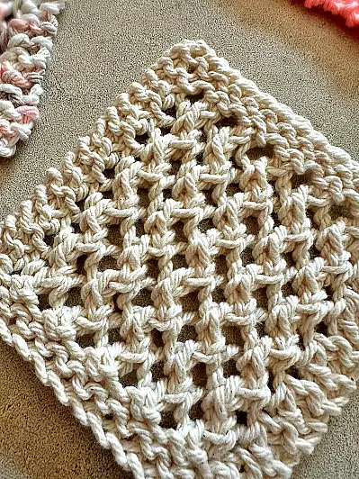 close up of stitch pattern for 4 row lattice dishcloth and coasters - free knitting pattern