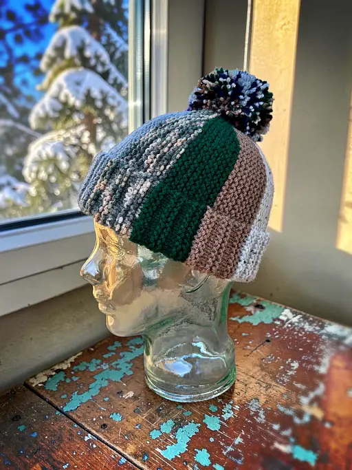 Flat knit winter hat with colourful scrap yarn