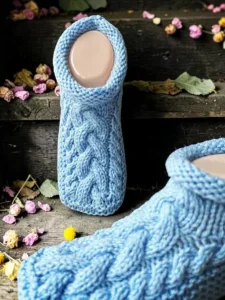 Close up view of cable knit slipper stitches showing the beautiful texture and cozy details