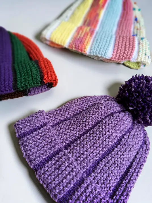 Scrap Beanie free knitting pattern featuring two-colour bobble hat knit flat on straight needles