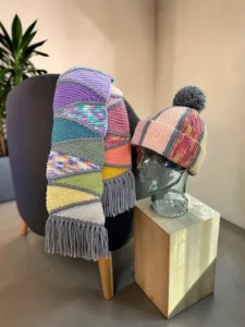Free scrap yarn scarf and beanie knitting patterns displayed as a matching winter set
