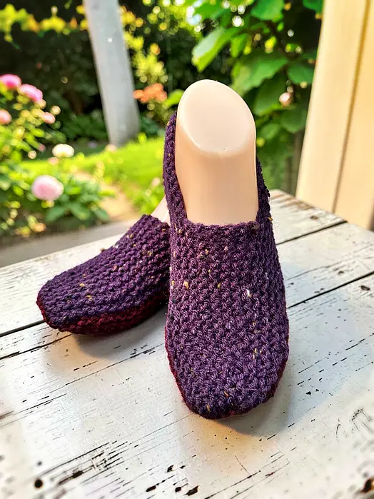 Top view of cozy knit slippers for adults with textured stitch pattern