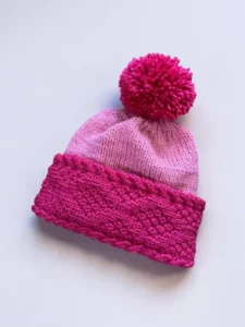 Beginner-friendly knitting pattern for a diamond brim beanie with video tutorials.